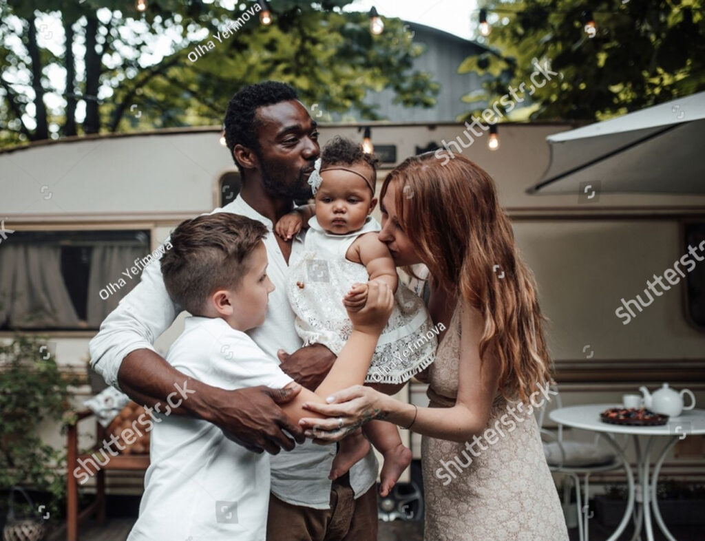 stock-photo-mixed-race-family-with-white-son-and-infant-swarthy-daughter-spend-time-together-in-camper-park-23061293212